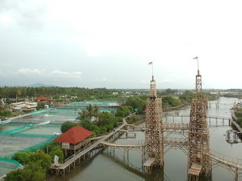 High angle view of buildings and river against sky