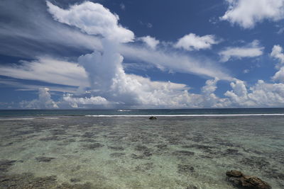 View of calm sea against cloudy sky