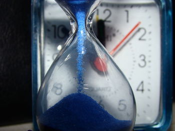 Close-up of clock on glass