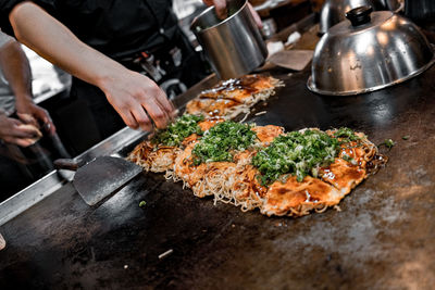 Midsection of man preparing food