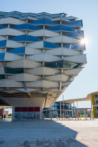 Modern building against blue sky on sunny day