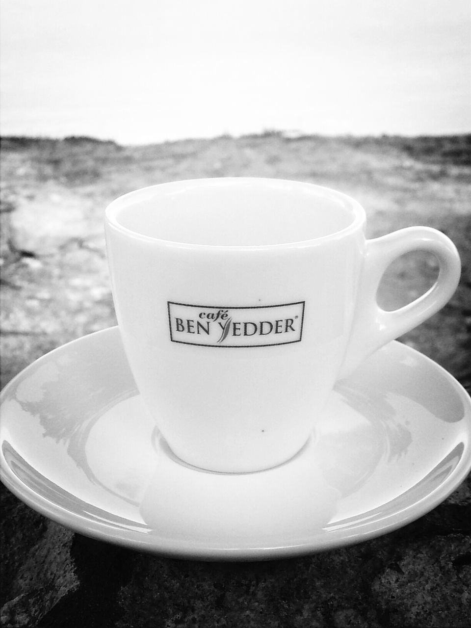 drink, coffee cup, food and drink, refreshment, text, coffee - drink, western script, saucer, table, communication, close-up, still life, indoors, coffee, cup, freshness, frothy drink, focus on foreground, no people, tea cup