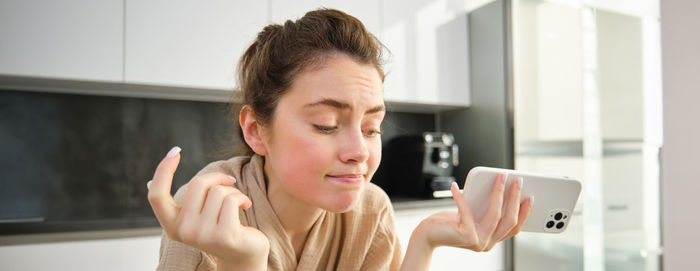 Young woman using mobile phone