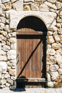 Closed door of stone wall