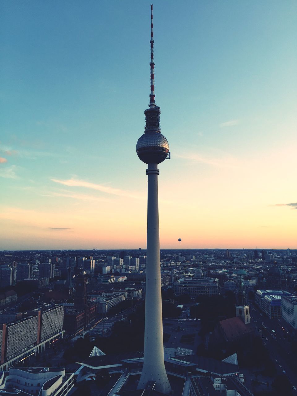 tower, architecture, building exterior, built structure, tall - high, city, communications tower, cityscape, sunset, capital cities, international landmark, travel destinations, famous place, tourism, sky, spire, television tower, travel, skyscraper, communication