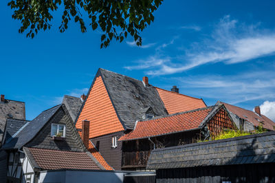 Houses in town against sky