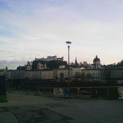 Buildings against cloudy sky