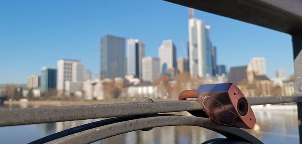 Metal railing against buildings in city