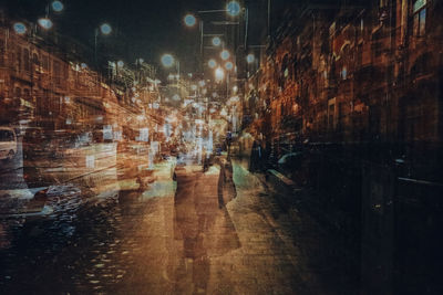People walking on street at night
