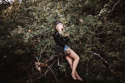 Woman looking at tree