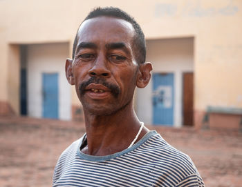 Portrait of man standing outdoors