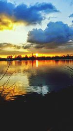 Scenic view of lake at sunset