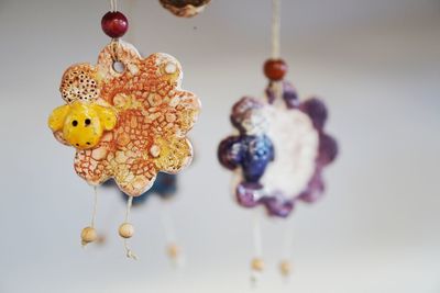 Close-up of decoration hanging over white background