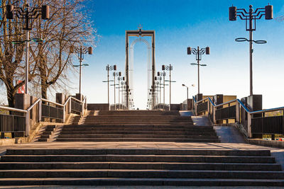 Steps against sky in city