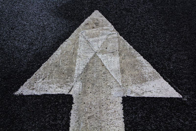 Arrow sign on road