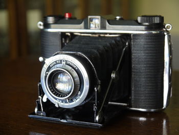 Close-up of vintage camera on table