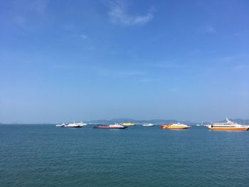 Scenic view of sea against blue sky