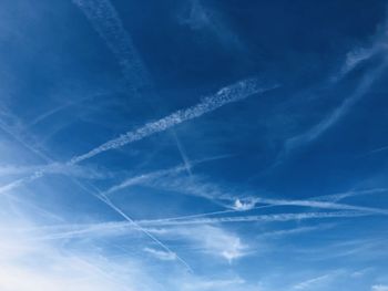 Low angle view of vapor trails in sky