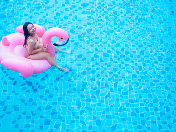 Young woman swimming in pool