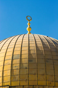 Low angle view of building against blue sky