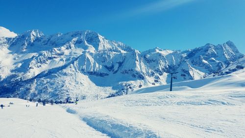 Scenic view of snow covered mountains