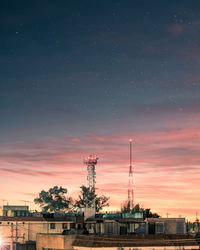 Factory against sky at night