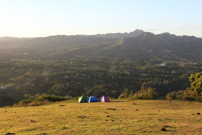 Scenic view of landscape and mountains against sky