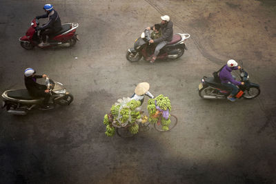 High angle view of people riding motorcycle