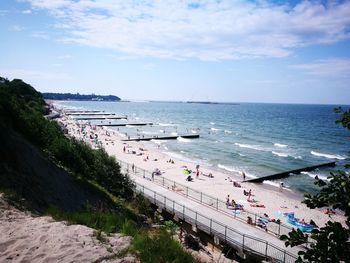 High angle view of people on beach against sky