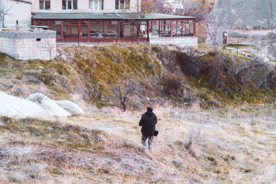Rear view of people walking in winter
