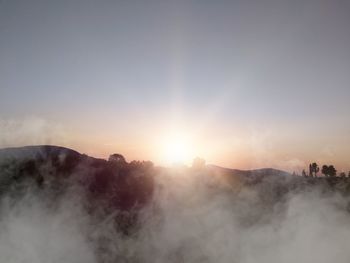 Scenic view of mountains against sky during sunset