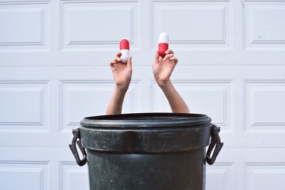 Human hands holding capsules