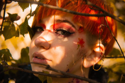 Close-up portrait of young woman looking away