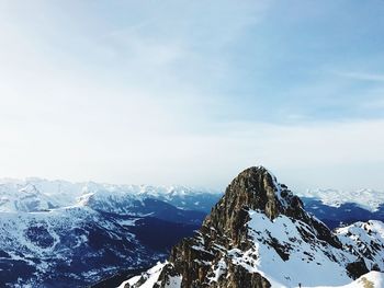 Scenic view of snowcapped mountains against sky