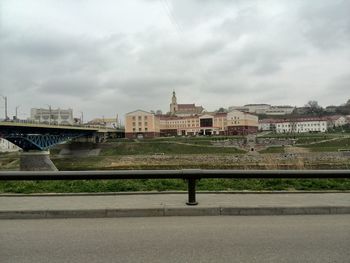 Buildings against cloudy sky