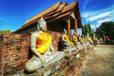 Row of buddha statues at wat yai chai mongkhon