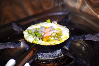 High angle view of eggs in cooking pan