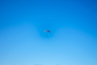 Paragliding in the blue sky 