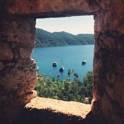 High angle view of sea seen through cave