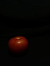 Close-up of apple against black background