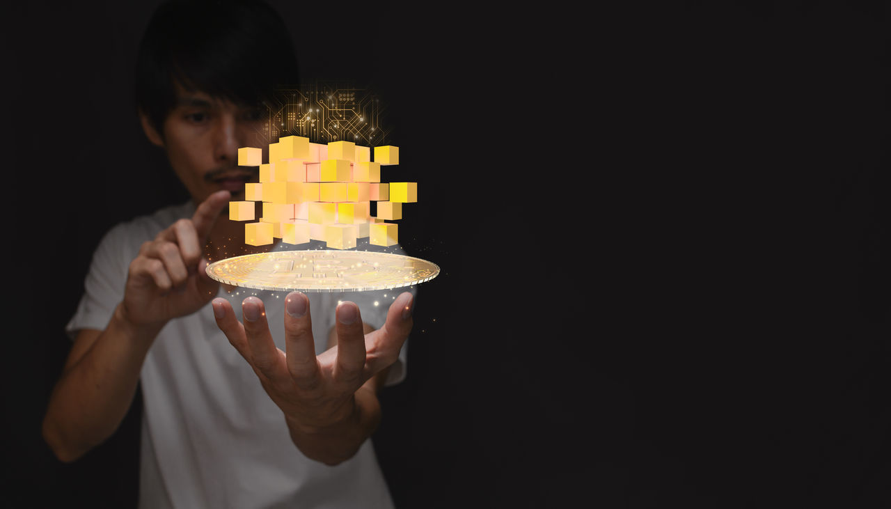 one person, holding, food and drink, birthday cake, food, black background, sweet food, copy space, indoors, unhealthy eating, sweet, studio shot, dessert, portrait, cake, adult, person, men, front view, dark, waist up, baked, temptation, lighting, casual clothing, child, childhood, freshness, hand, young adult