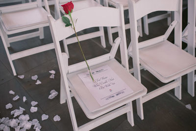 High angle view of chairs on table