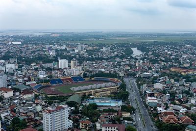 High angle view of buildings in city against sky