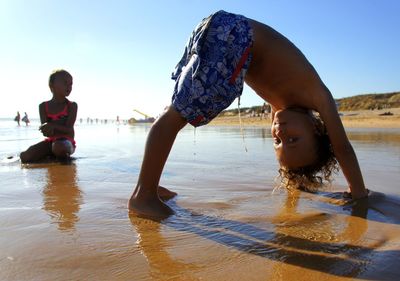 Children on sunny beach in algarve