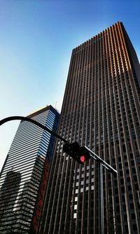 Low angle view of skyscraper against clear sky