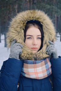 Portrait of young woman in snow