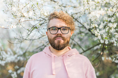 Low angle view of man standing against trees