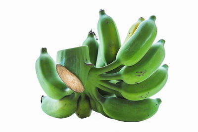 Close-up of bananas against white background