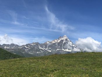 Scenic view of snowcapped mountains against sky