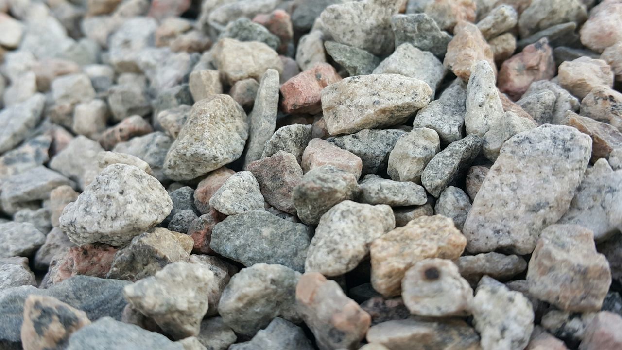 full frame, backgrounds, abundance, large group of objects, textured, stone - object, pebble, close-up, rock - object, high angle view, nature, stone, day, rough, outdoors, no people, natural pattern, heap, pattern, stack
